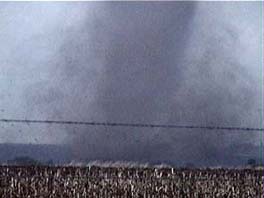 photo of tornado destroying structures